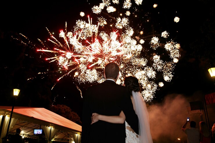 happy-hugging-bride-groom-watching-beautiful-colorful-fireworks-night-sky_1304-3968